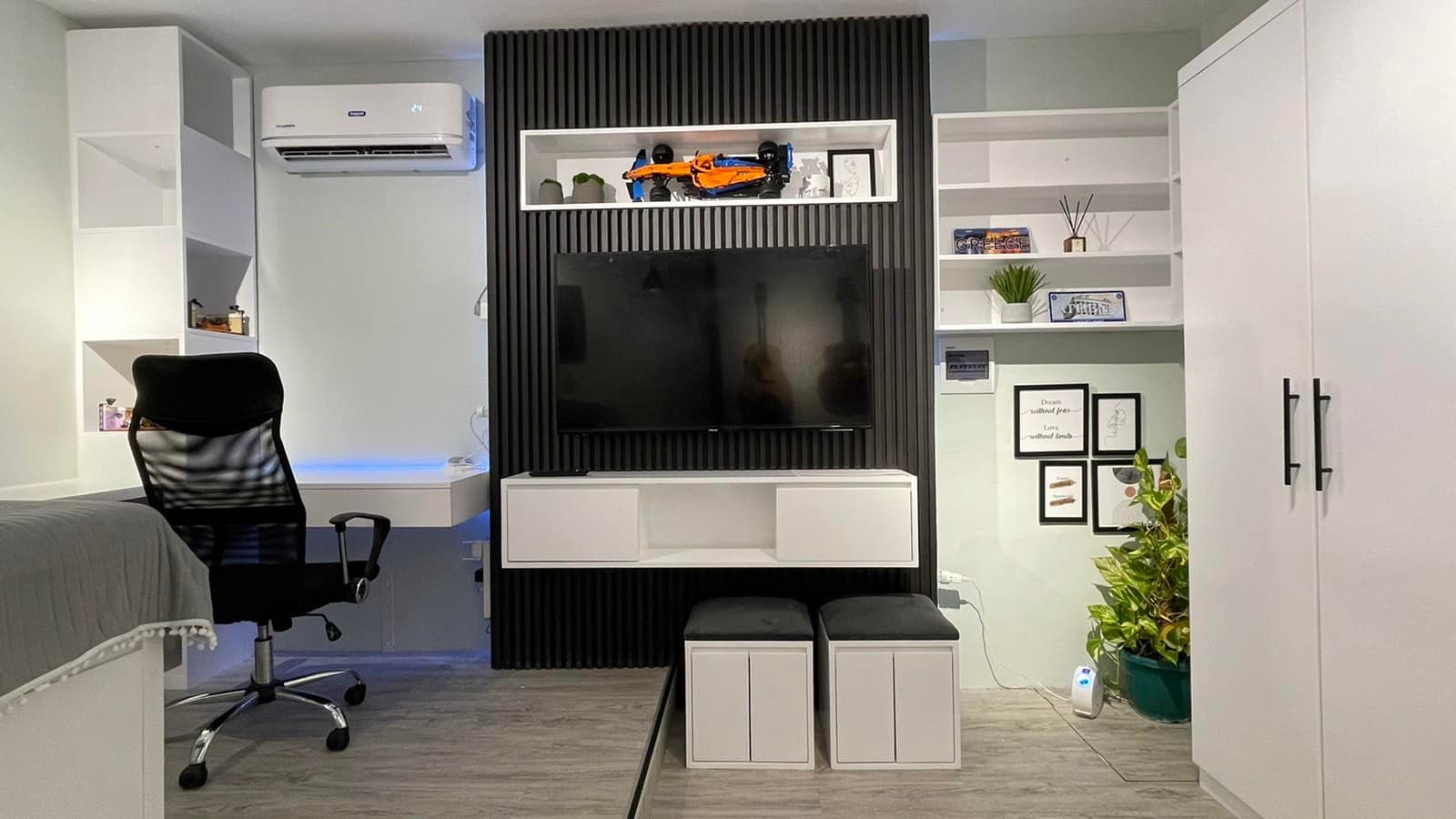 Contemporary bedroom with black accent wall